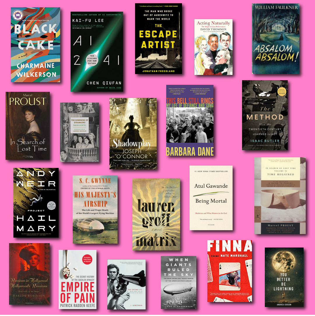 book covers against bright pink background